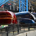 The Mallard and a red locomotive showcased at the York Railway Museum