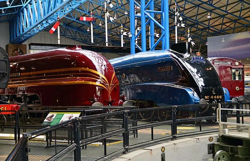 The Mallard and a red locomotive showcased at the York Railway Museum